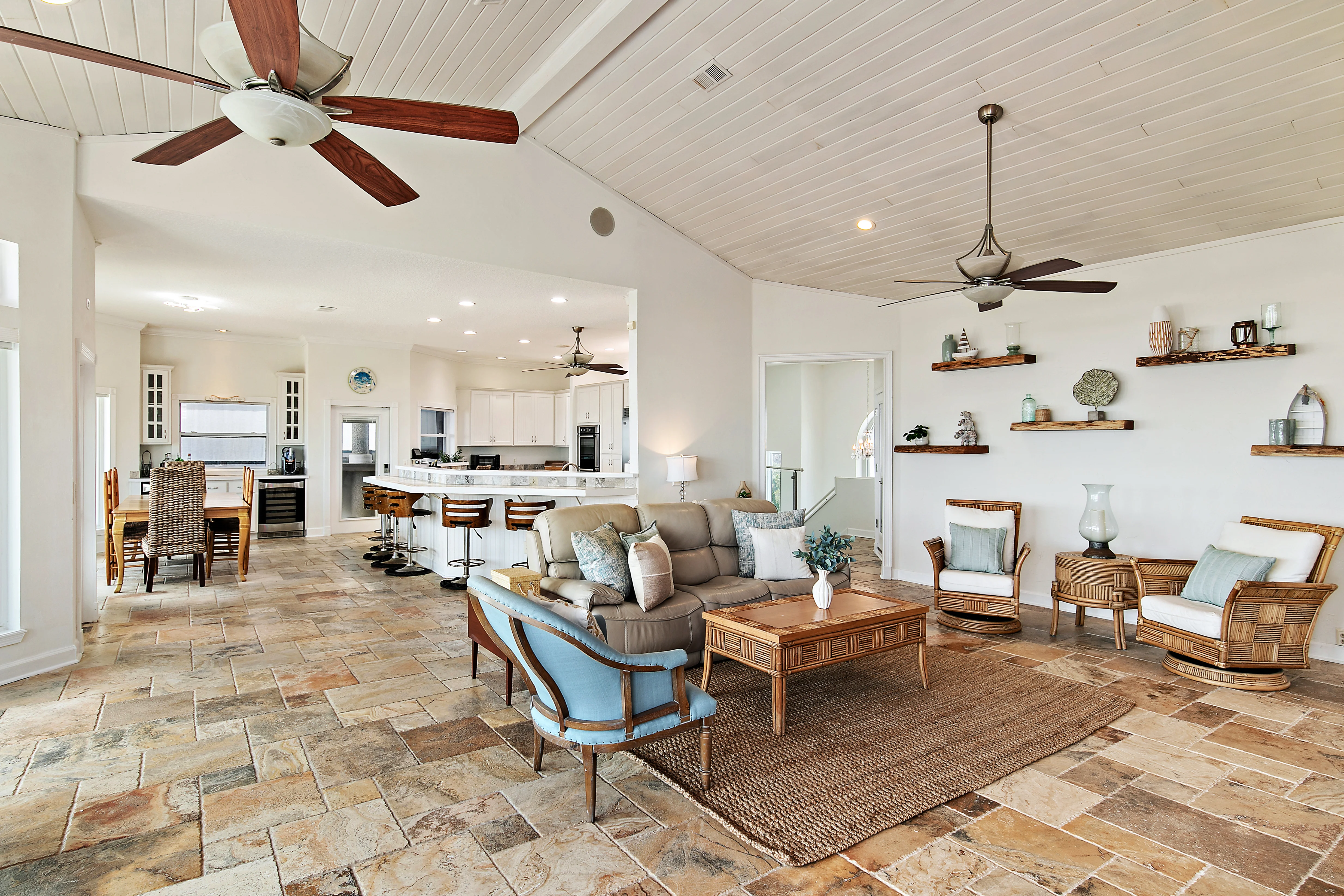 Open living space with vaulted ceilings and view to kitchen Open living space with vaulted ceilings and view to kitchen