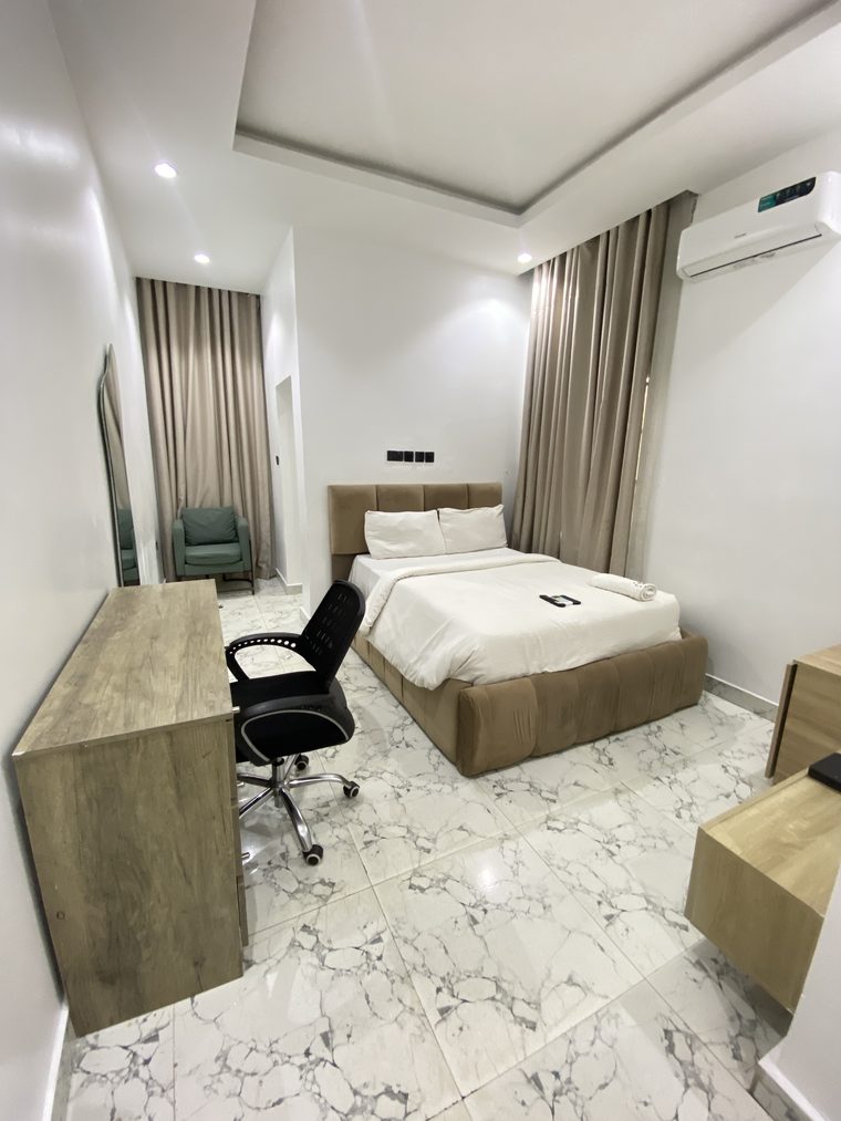 Superior Room with desk, office chair and full-length mirror