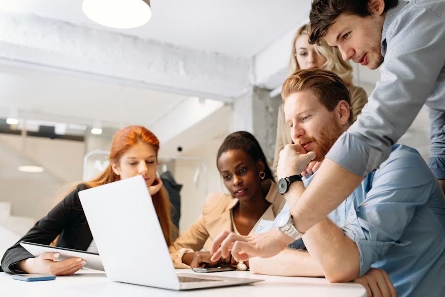 Creative business people and designers brainstorming in a modern office environment.