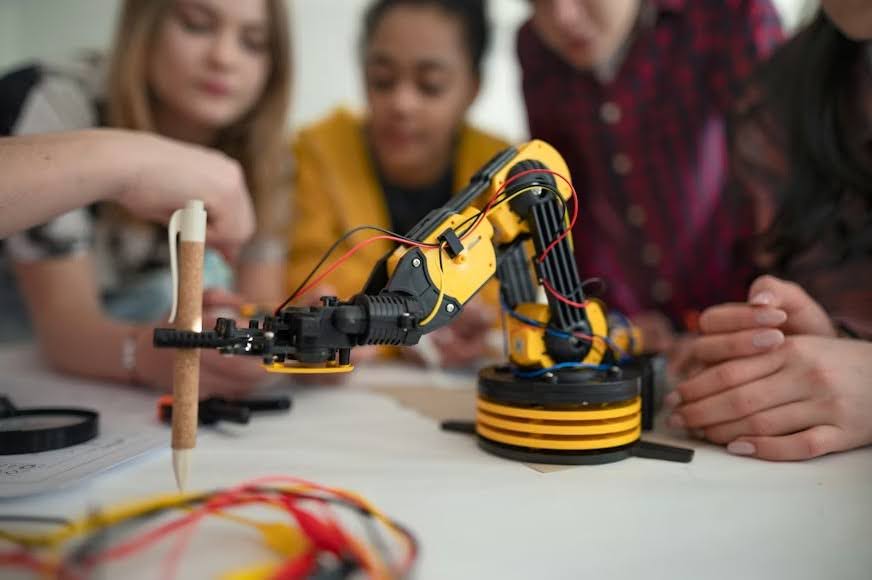  A group of young tech professionals testing an electric toy prototype.