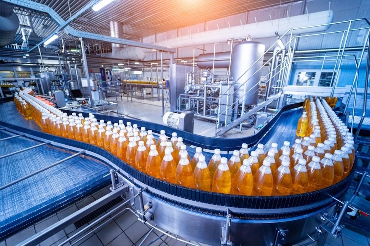 Conveyor belt with bottles for juice at a modern beverage plant Conveyor belt with bottles for juice at a modern beverage plant