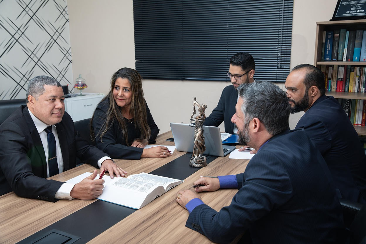 A group of lawyers is having a meeting in a conference room