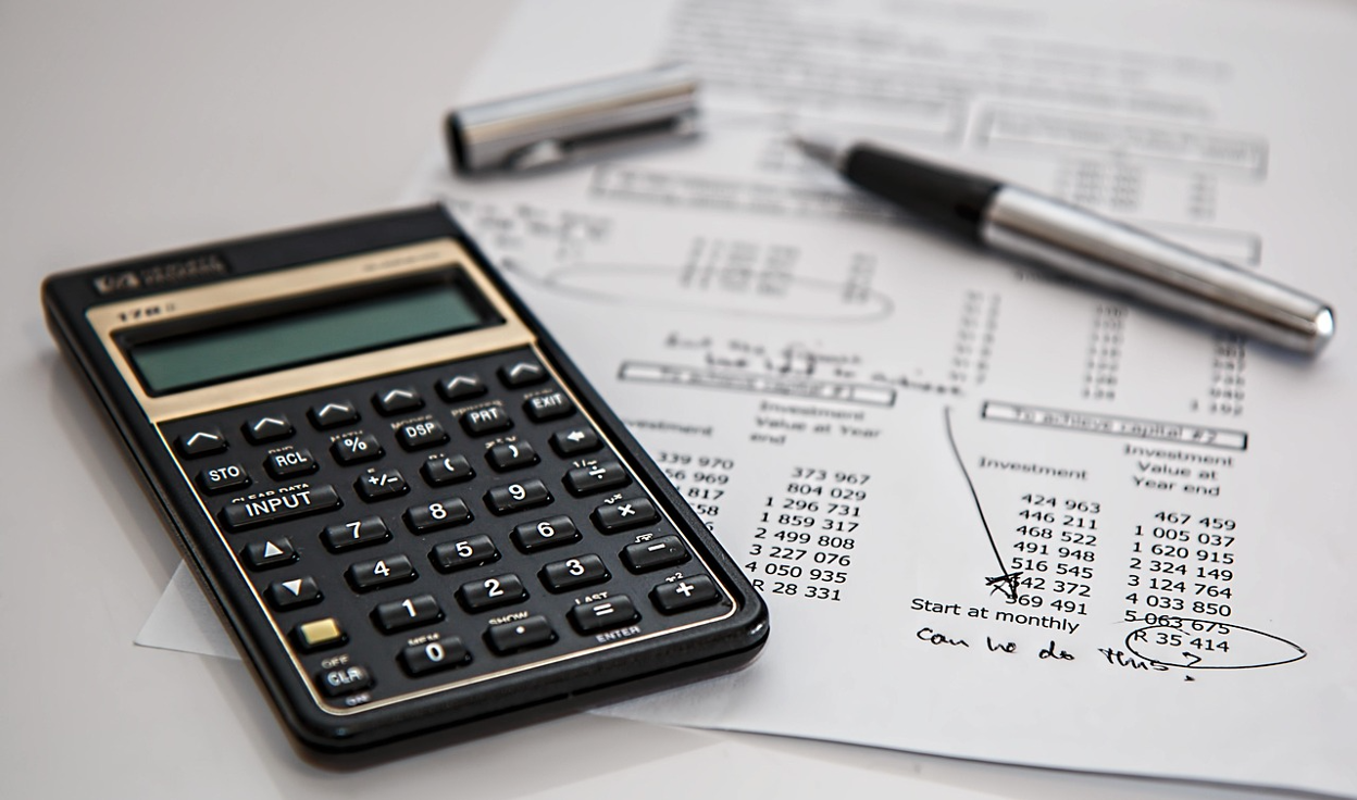 A calculator beside a financial statement