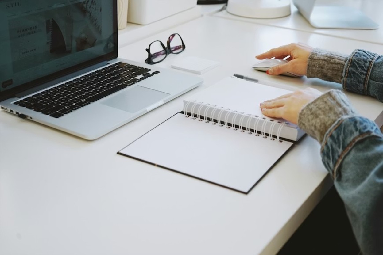A woman using her laptop to carry out a feasibility study
