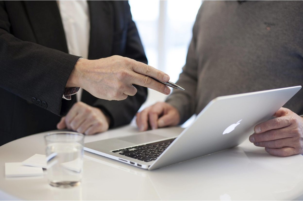 Two inventors going over the legal definition of Freedom to Operate on a computer