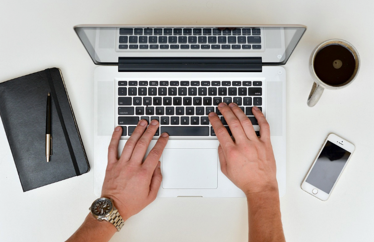 A person filling out a patent application online A person filling out a patent application online