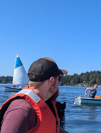 Horizons Unbound sailing instructor guiding youth training boats on the water