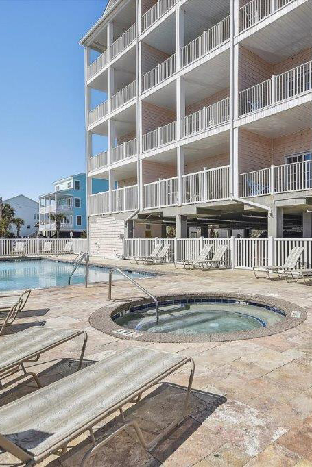 woman setting sheets on bed