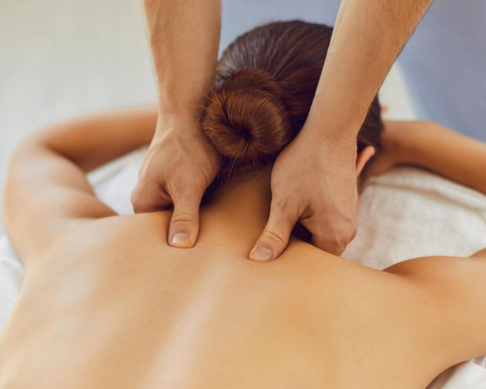 Massage therapy hands on patient back