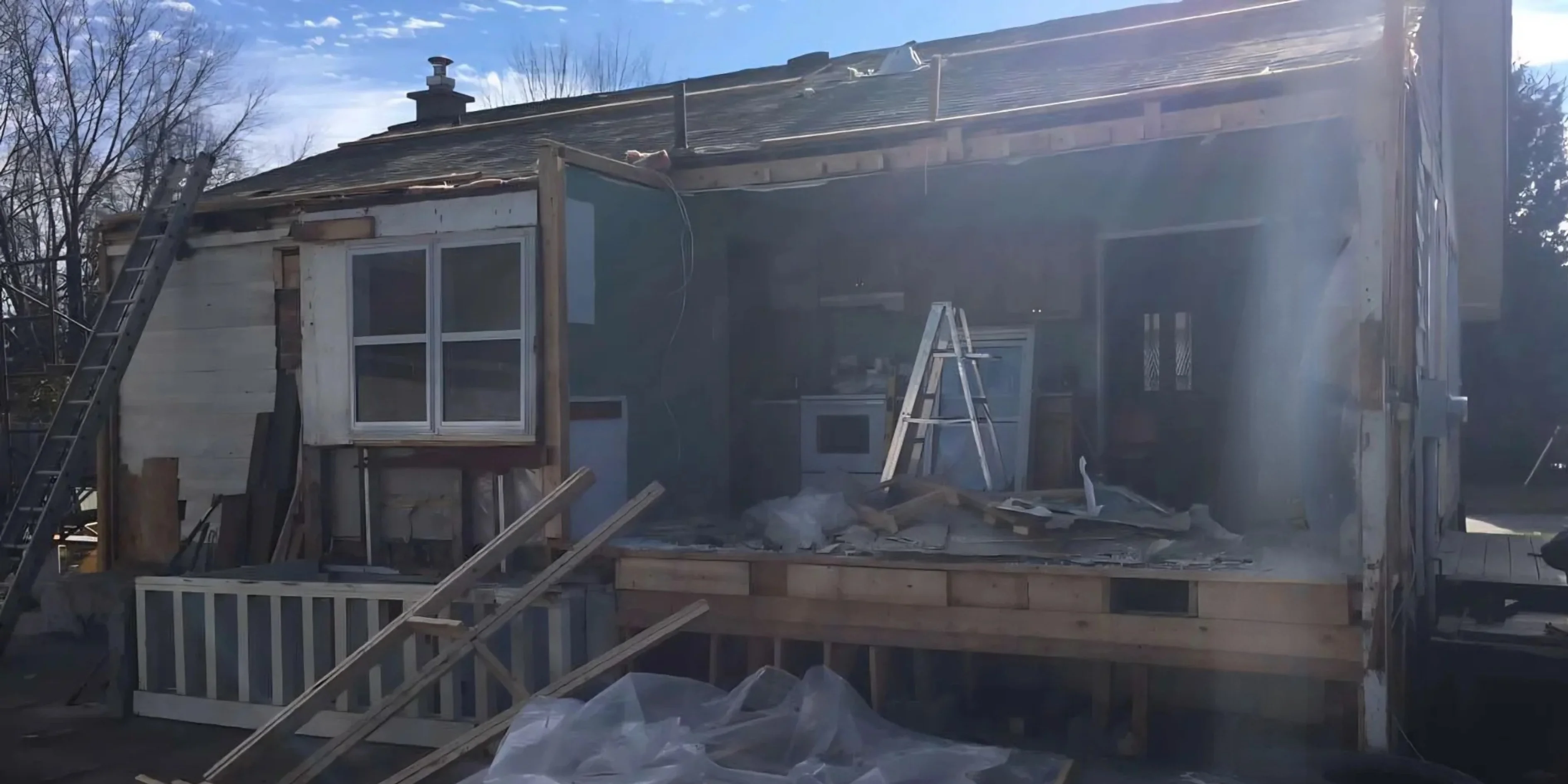 Excavator tearing down a structure