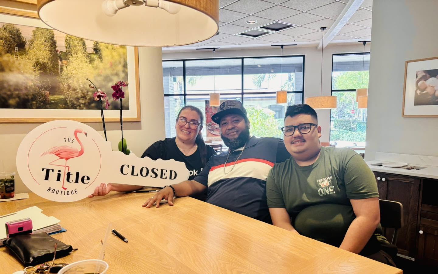Clients holding their Title Boutique closing key
