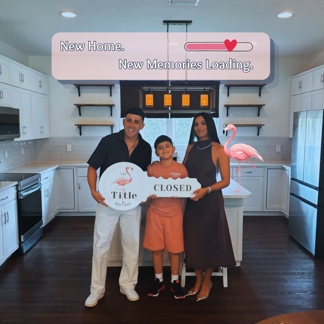 Clients holding their Title Boutique closing key