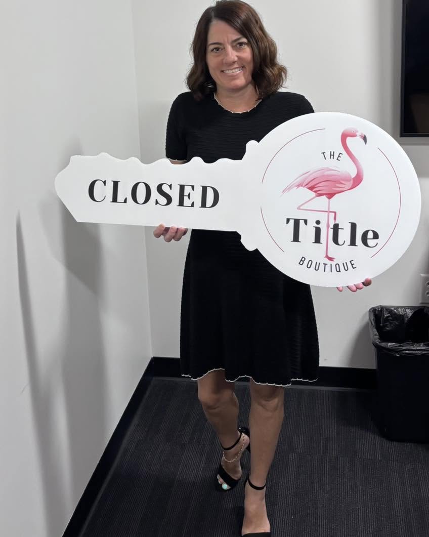Clients holding their Title Boutique closing key