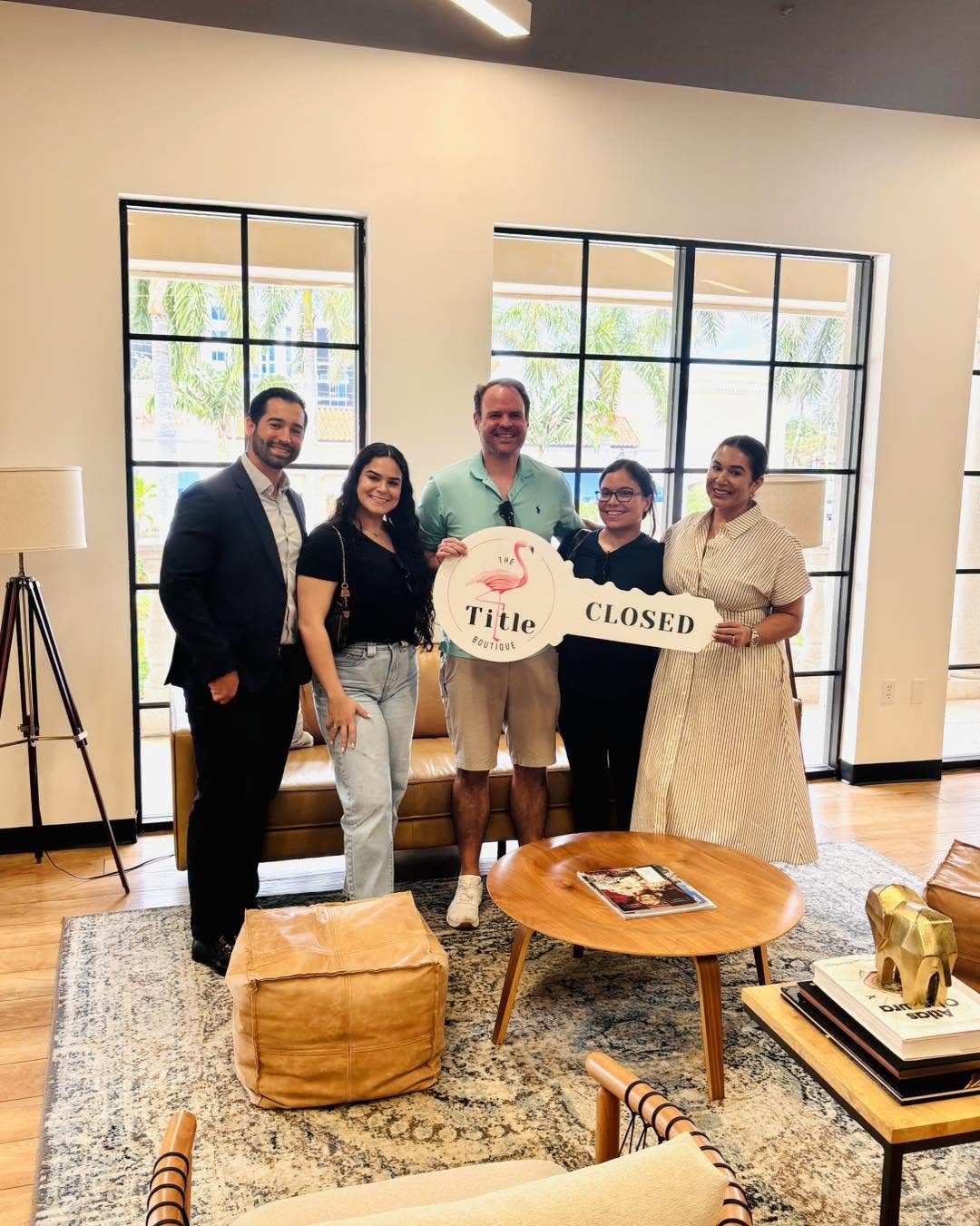 Clients holding their Title Boutique closing key