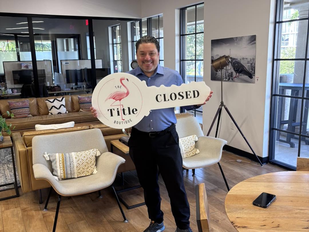 Clients holding their Title Boutique closing key