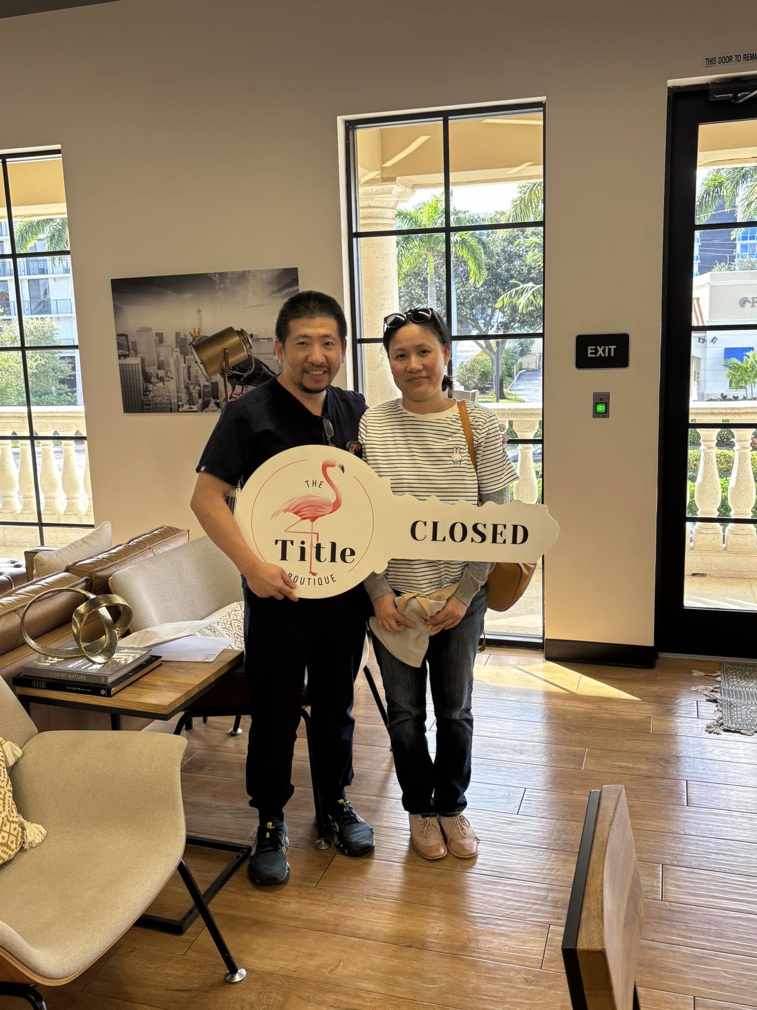 Clients holding their Title Boutique closing key