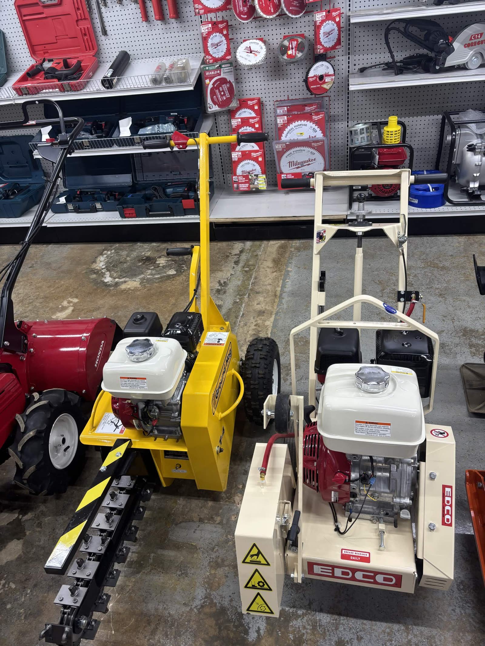 Yellow Ground Hog trencher and EDCO concrete saw on the rental floor at Cardinal Hardware