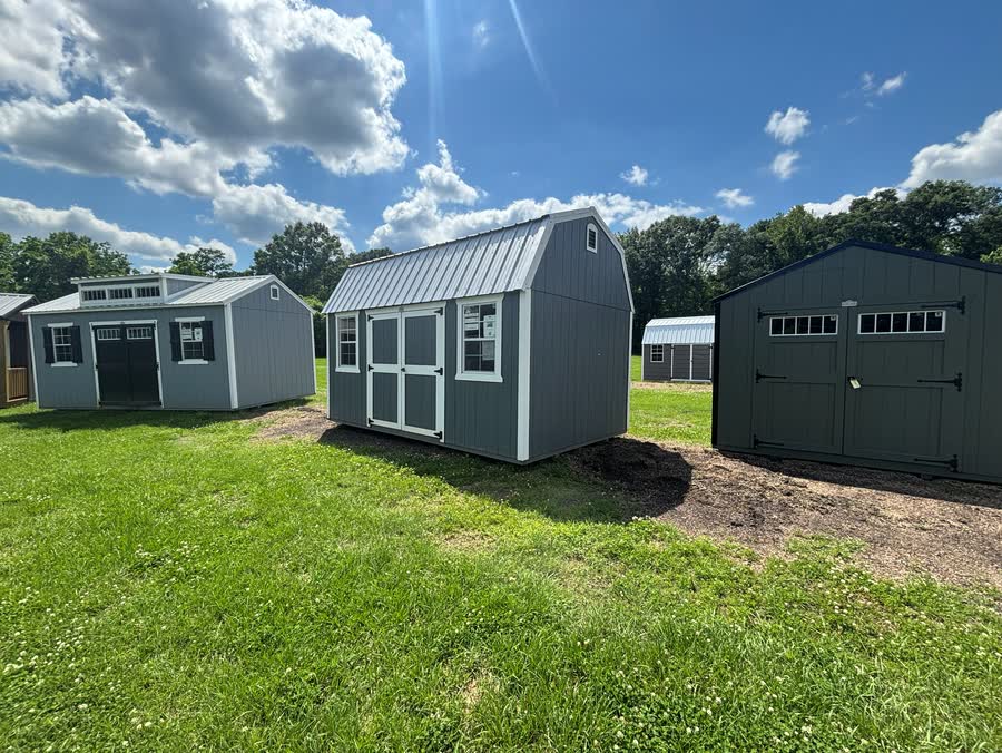Light-blue Stor-Mor side lofted barn with white trim and gambrel roof at Cardinal Hardware
