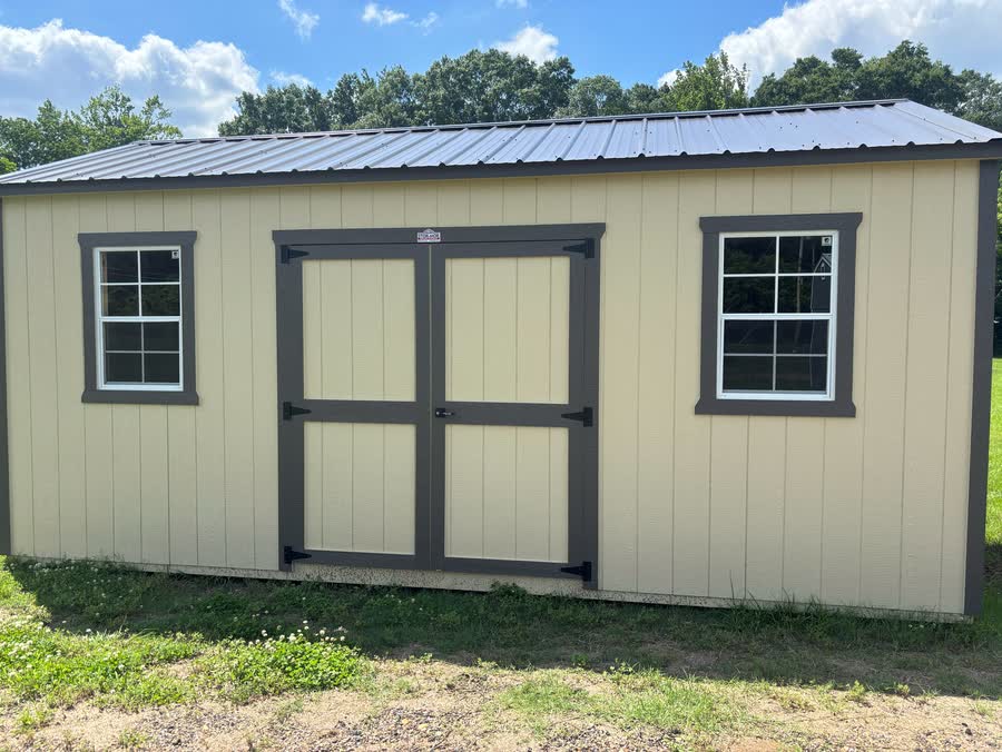 Tan Stor-Mor side utility shed with charcoal trim, double doors and two windows at Cardinal Hardware
