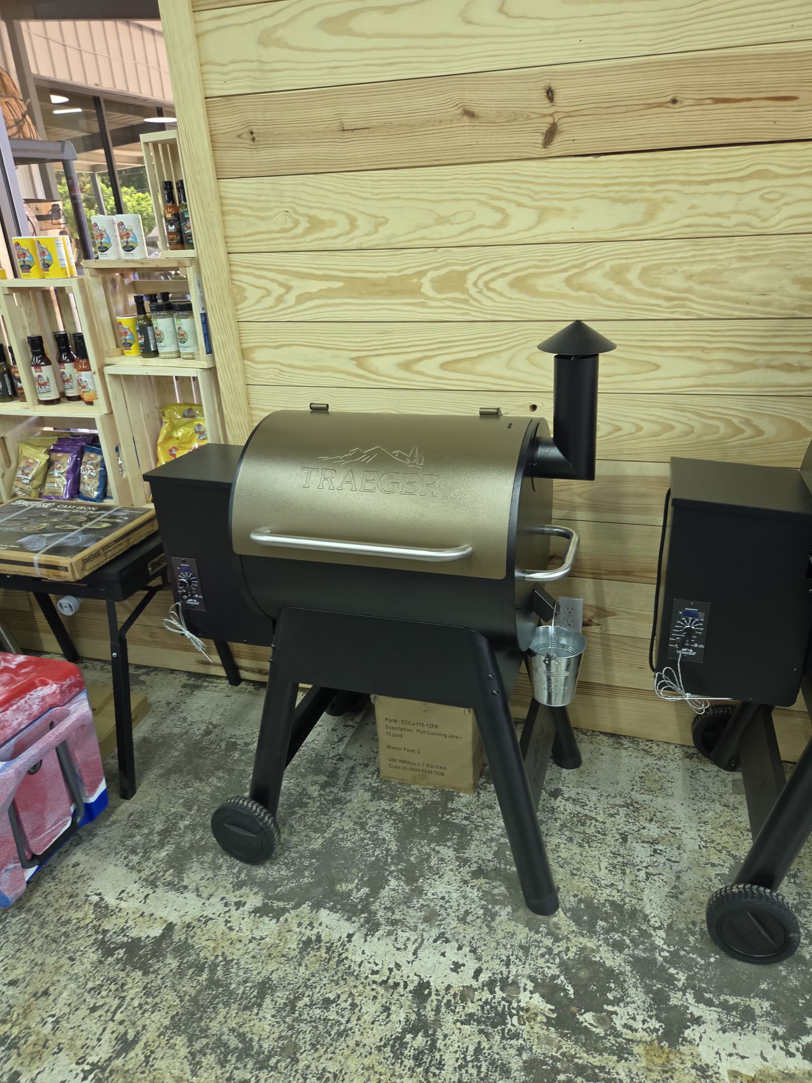 Traeger Pro pellet grill display with hickory pellets and grill tools at Cardinal Hardware