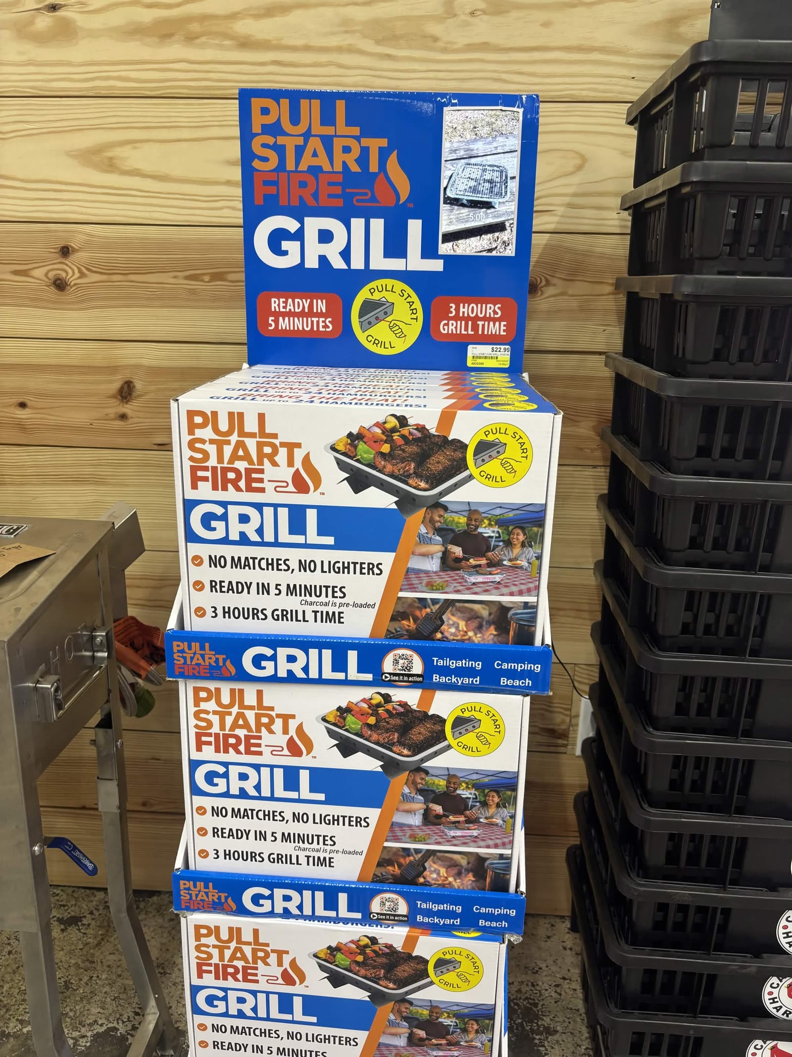 Pull Start Fire Grill display at Cardinal Hardware — pull-the-string portable charcoal grill, ready in 5 minutes, 3 hours grill time, grills up to 24 hamburgers