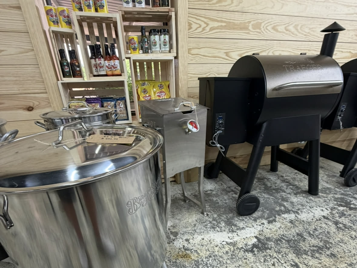 Traeger and Bayou Classic outdoor cooking display at Cardinal Hardware