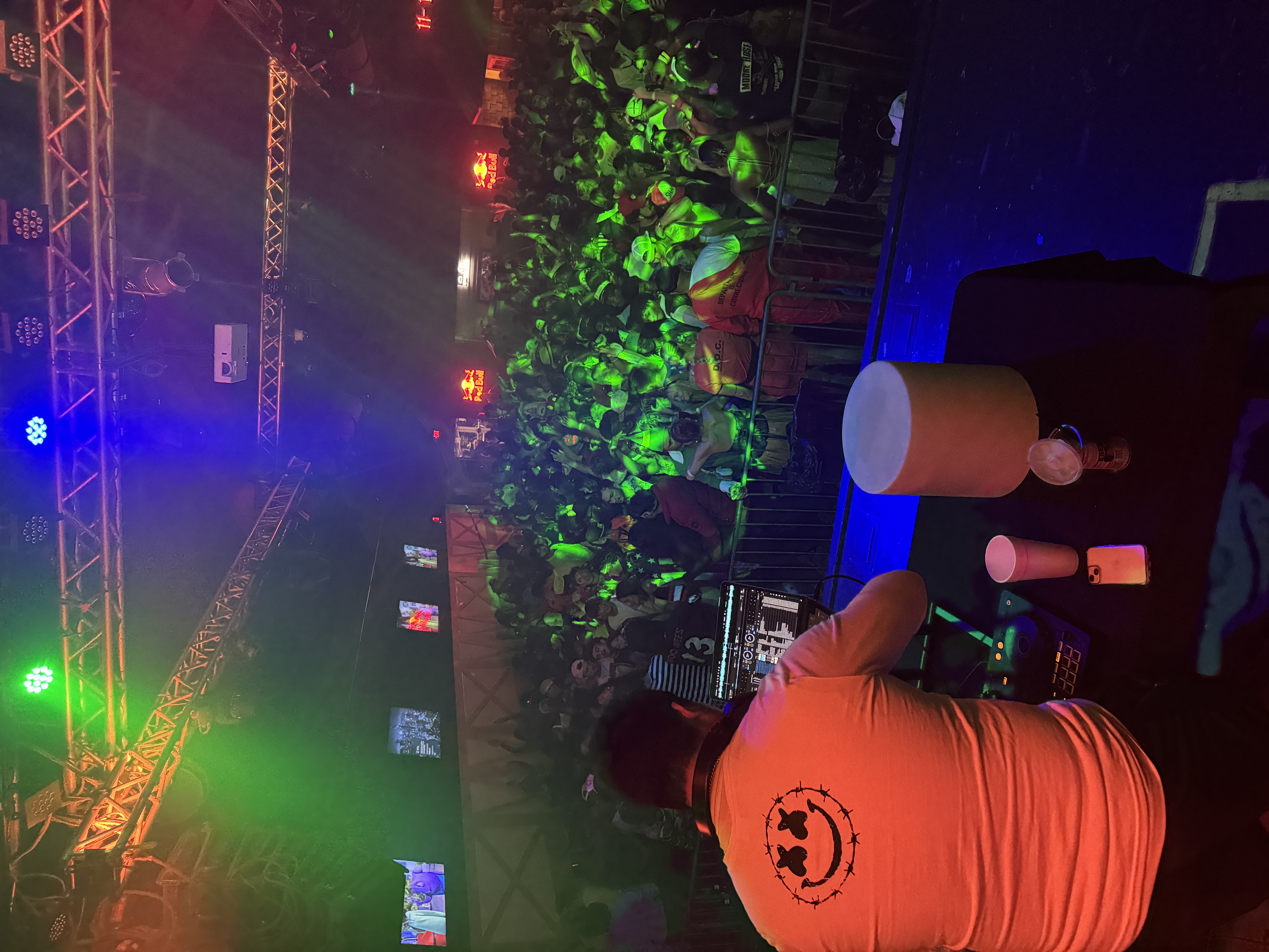 DJ Dragon performing live to a packed crowd on the dancefloor