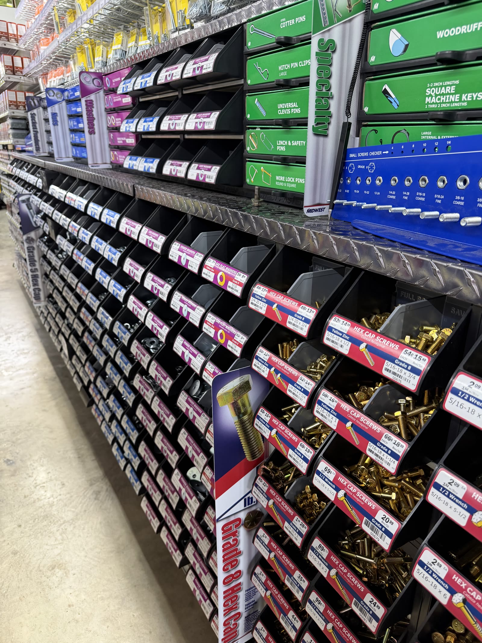 Fasteners and hardware aisle — bins of bolts, screws, and specialty hardware at Cardinal Hardware
