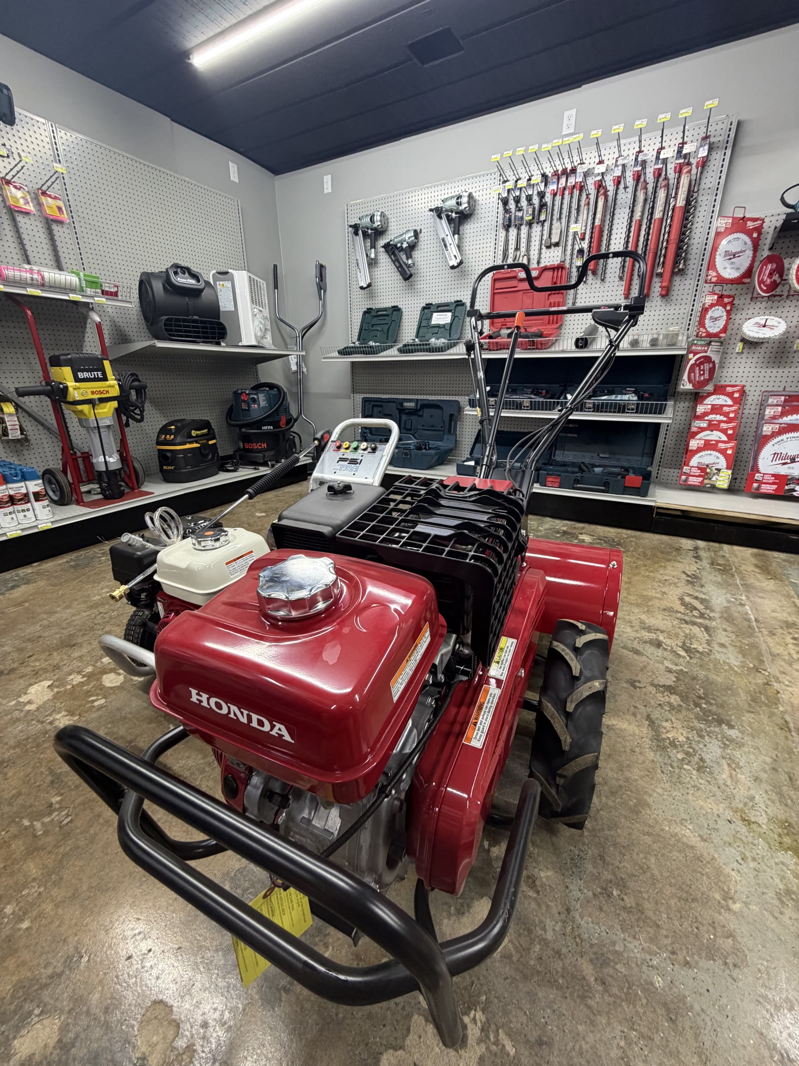 Honda rear-tine tiller in the rental room at Cardinal Hardware