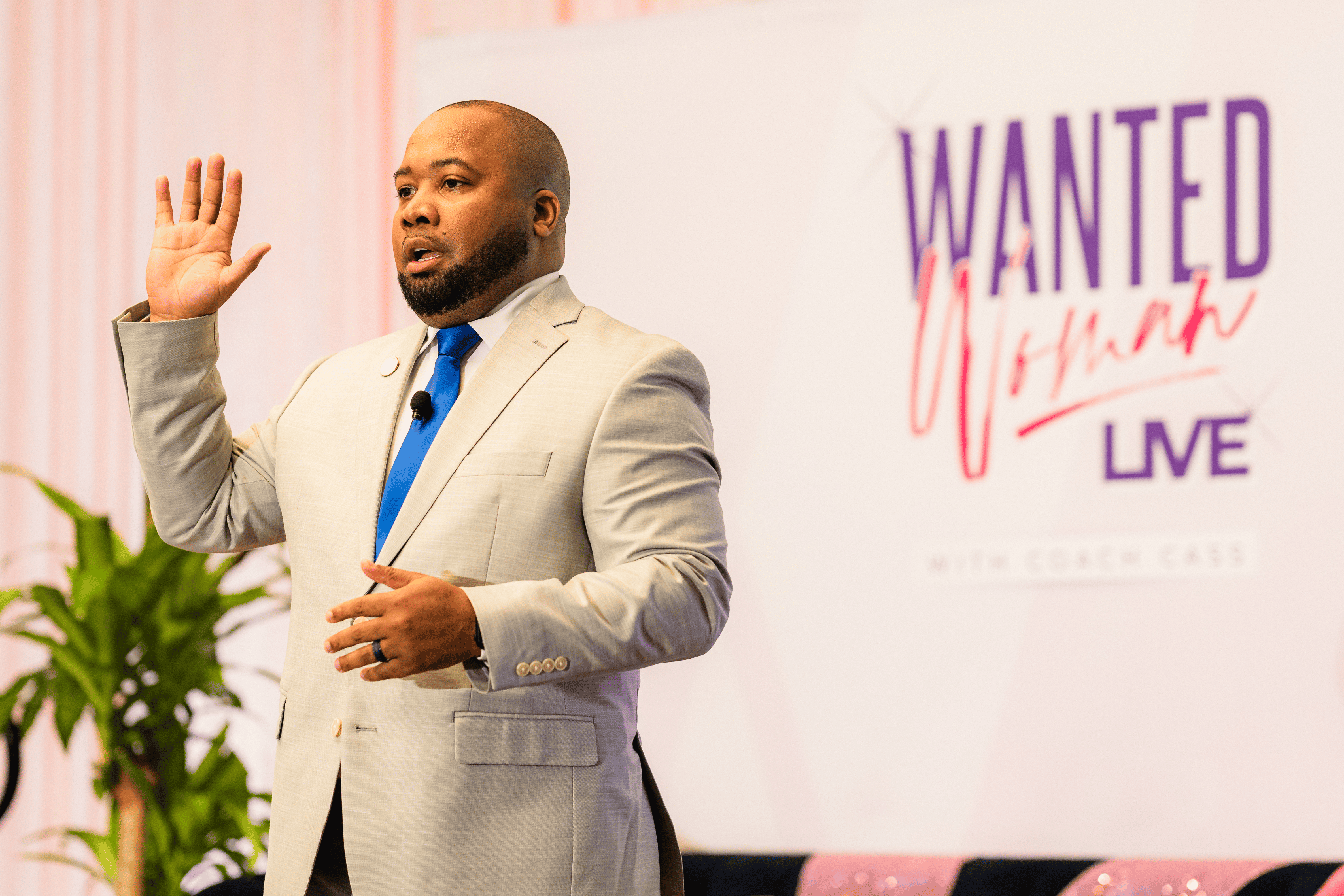 Jamal Vallair engaging a large audience from the stage