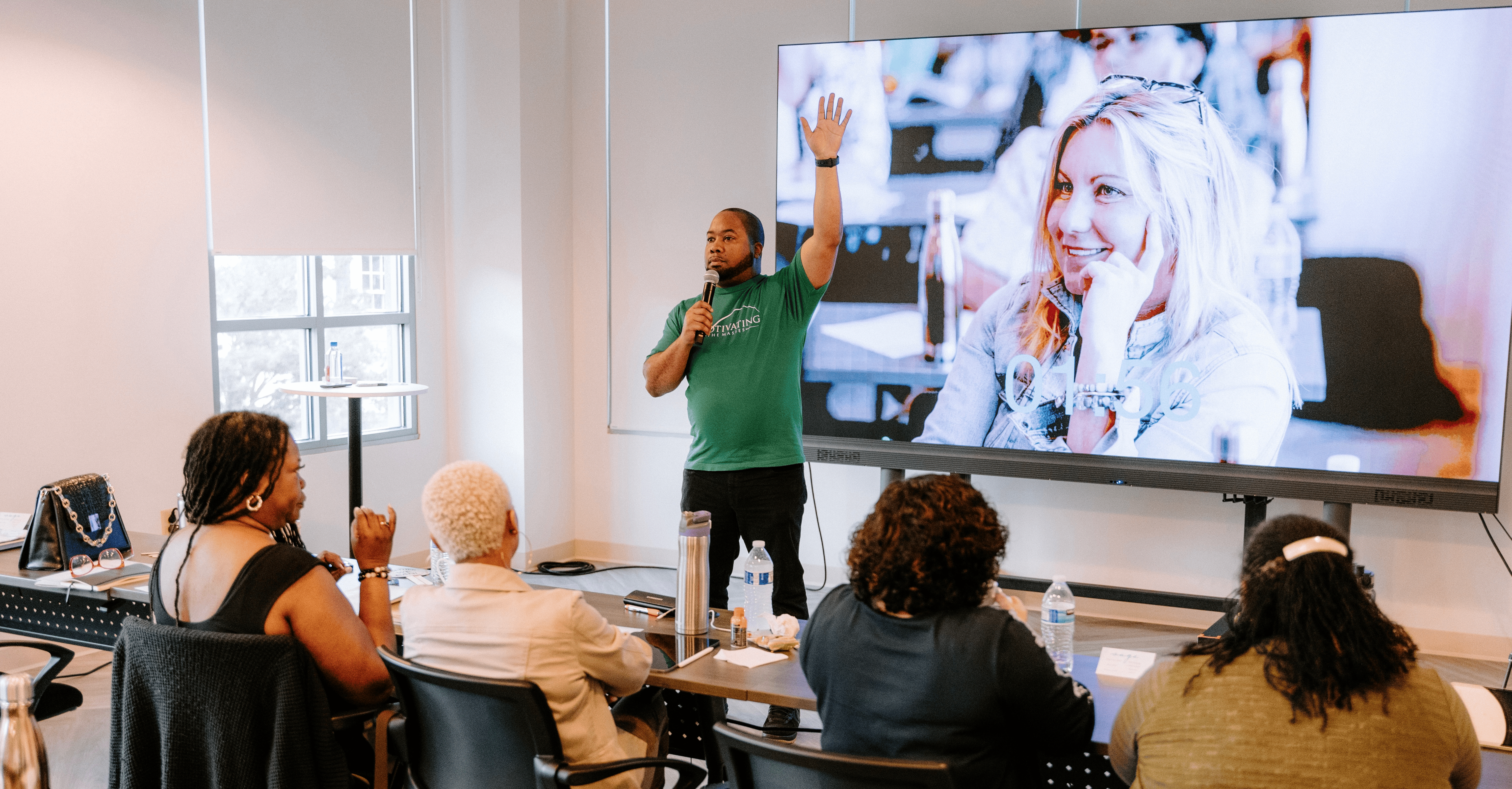 Jamal Vallair leading a transformational experience for a large audience