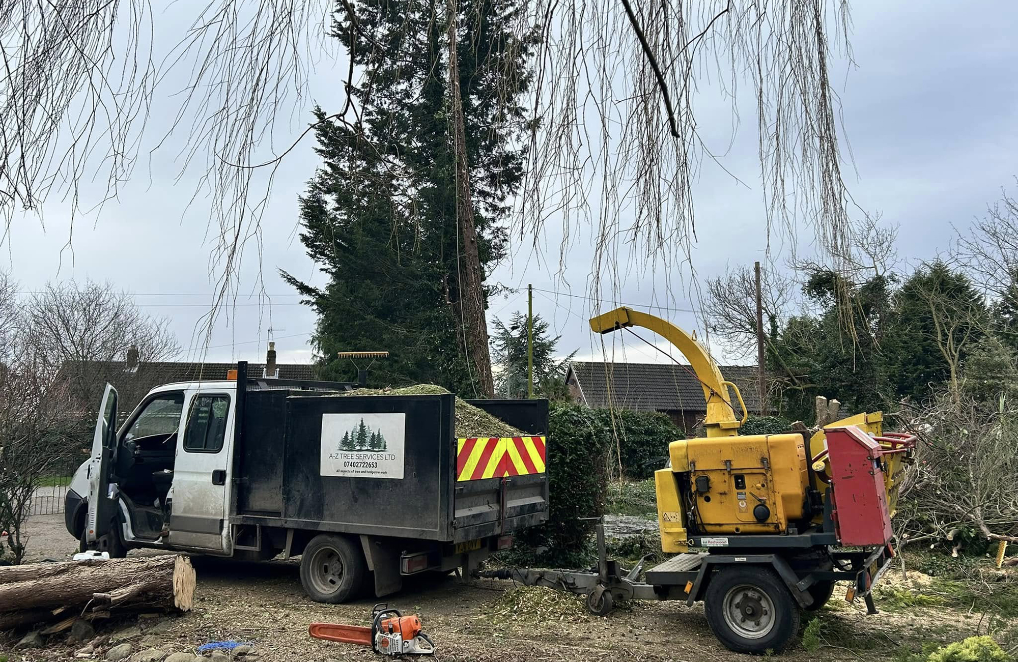 A-Z Tree Services truck and chipper on site