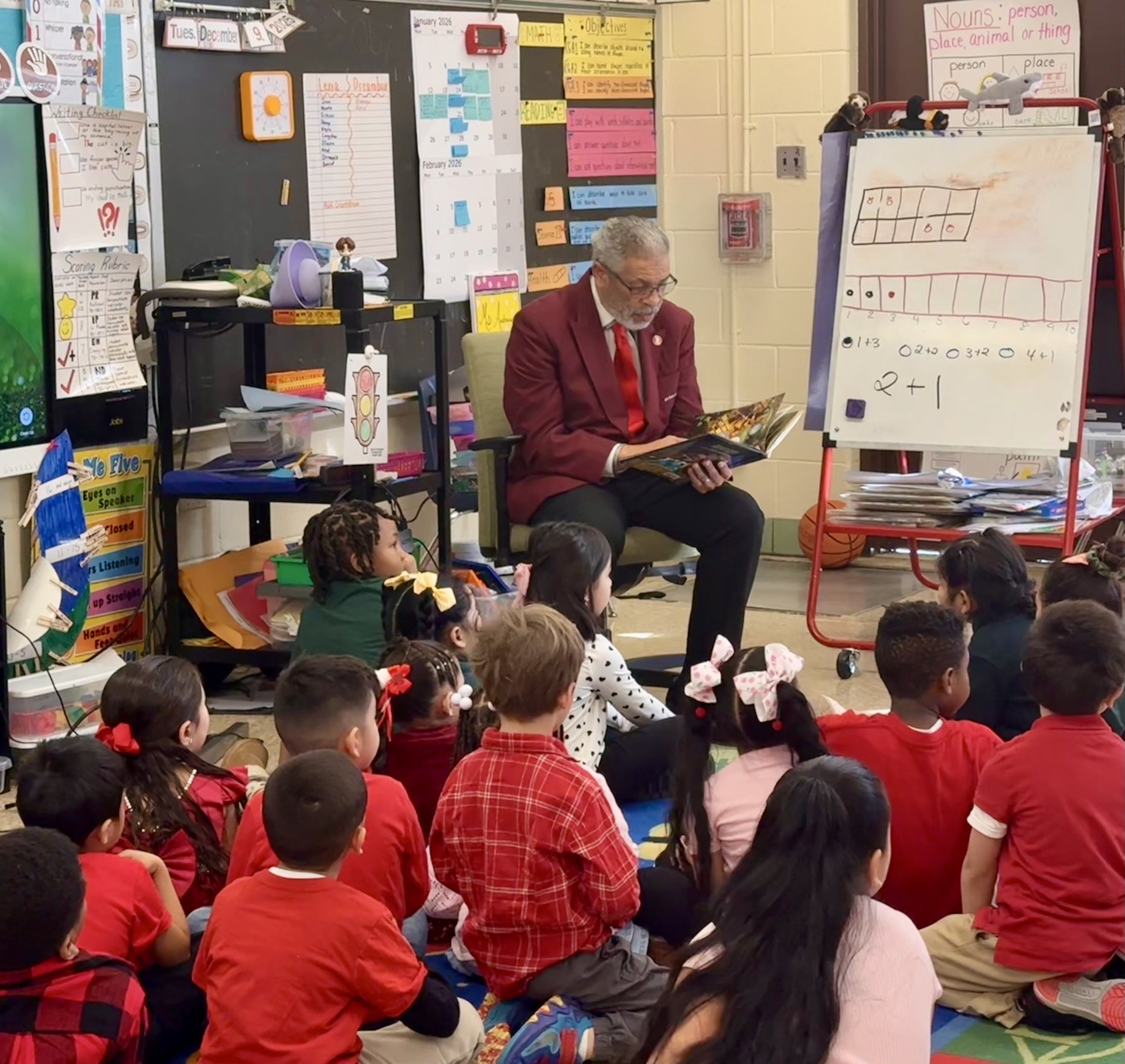 Chapter member reading to students