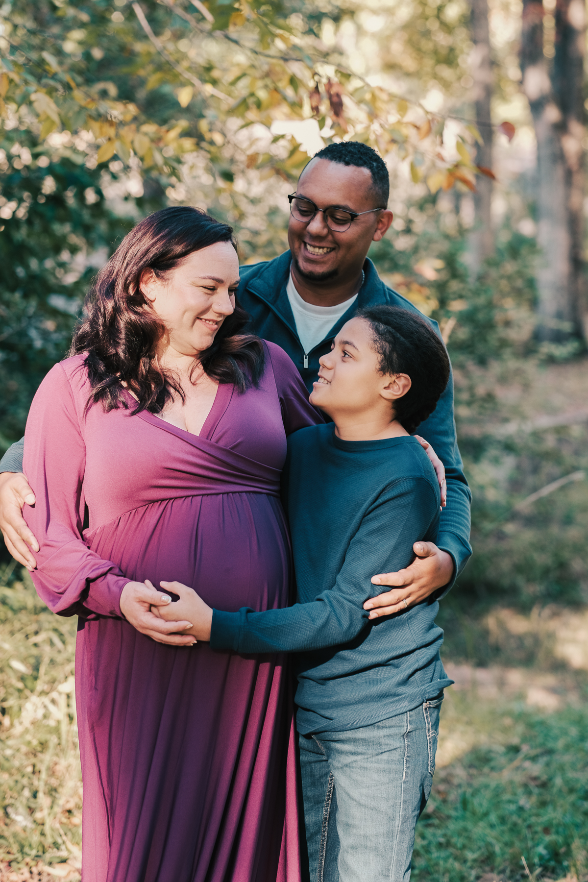 Warm, emotive family portrait photographed in studio by Kevin Doan, fine art children's photographer