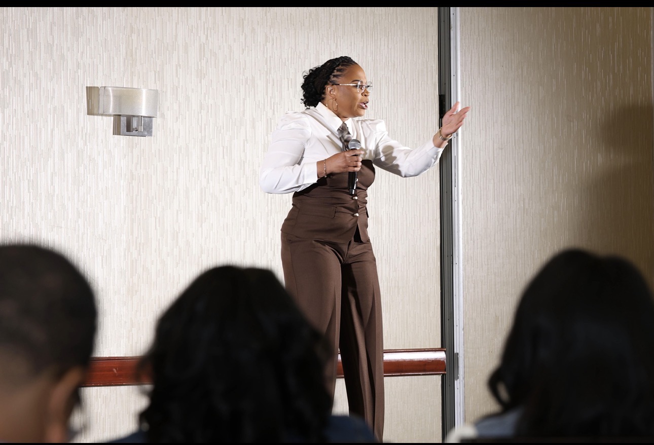Shardae Burt speaking to a full room