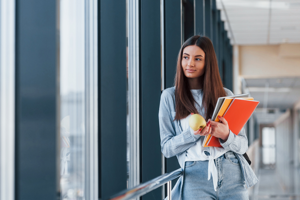 Student looking outside the university