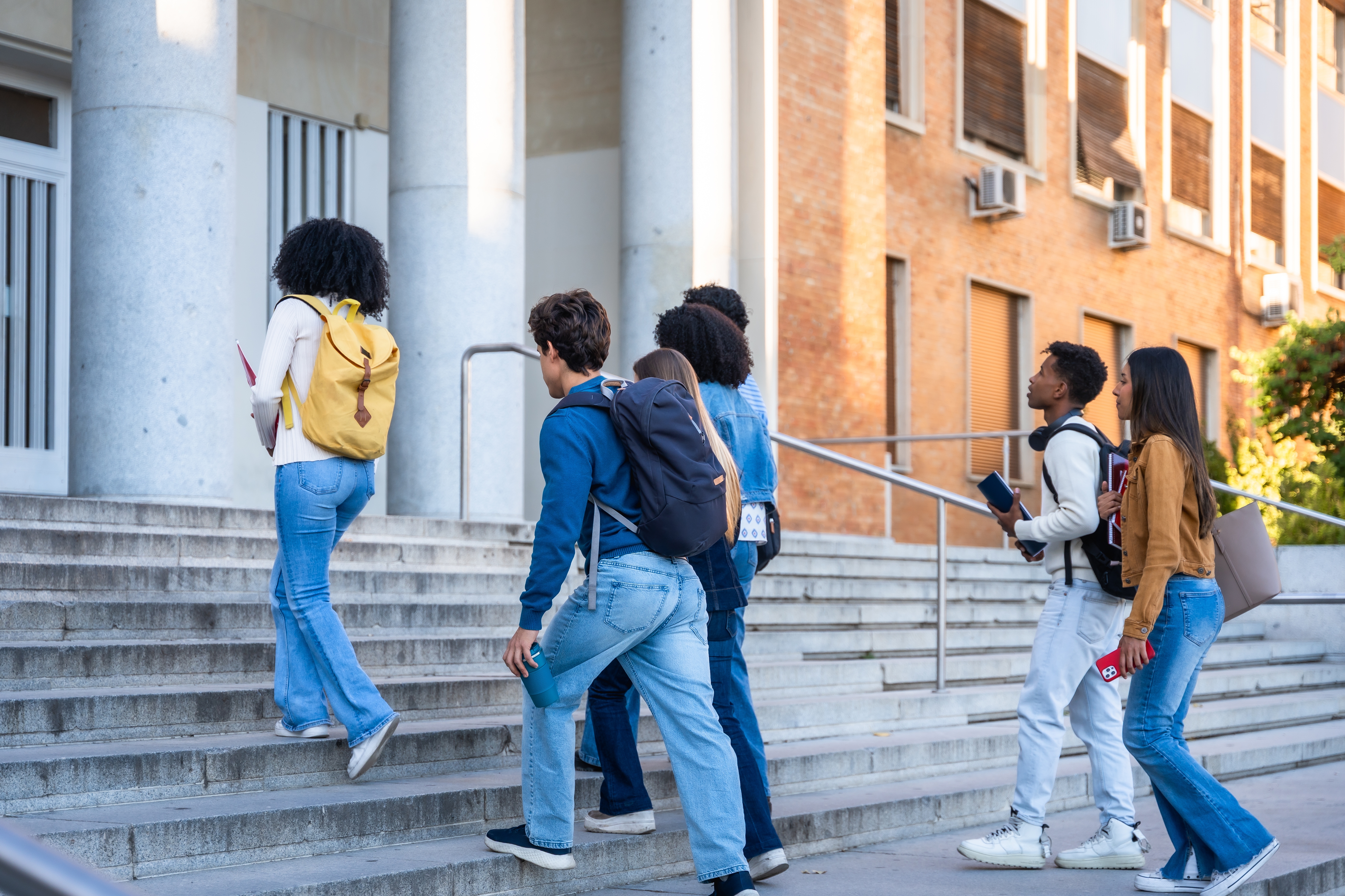 different students entering school building