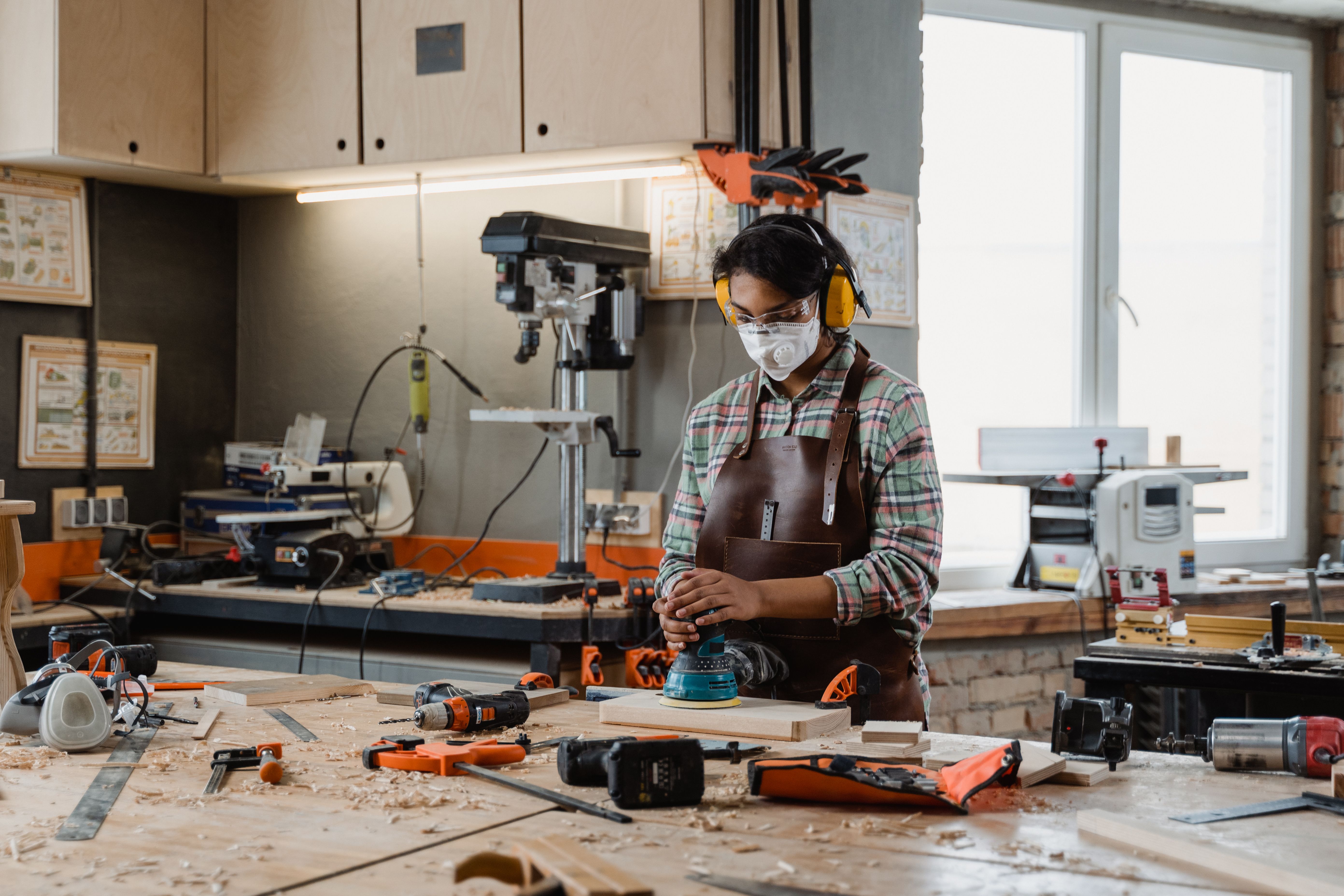 Students working with tools at the Construction 101 workshop