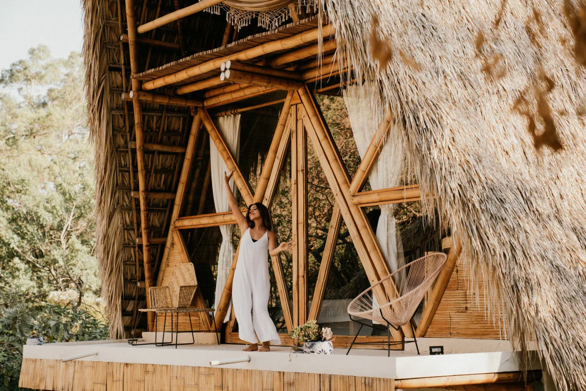 A practitioner on the bamboo pavilion terrace at the Vādma training venue in Mexico