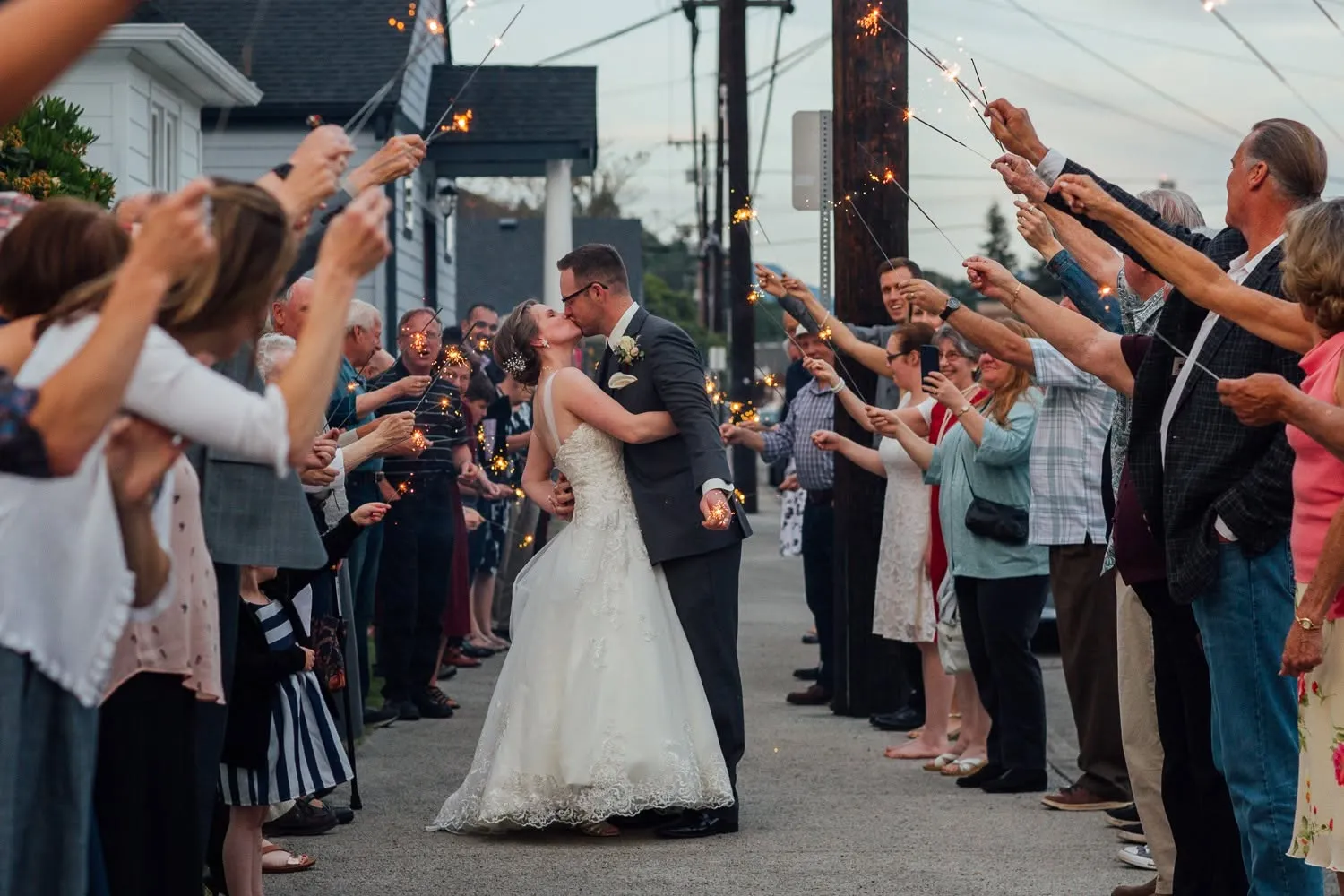 Bride and groom during a sparkler sendoff outside Madison Hill Chapel