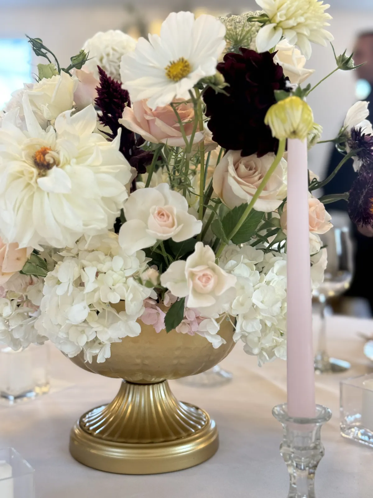 Gold vase centerpiece with white and blush flowers