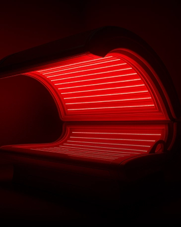 Red light therapy bed glowing
