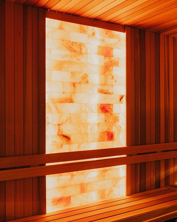 Traditional sauna with glowing salt wall