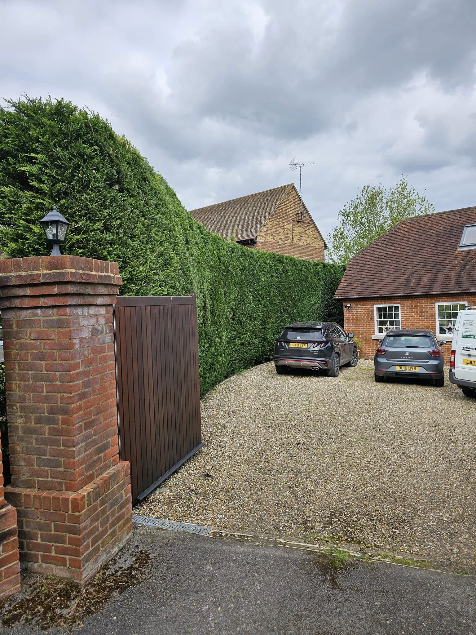 Freshly mowed lawn and tidy garden in front of a UK home