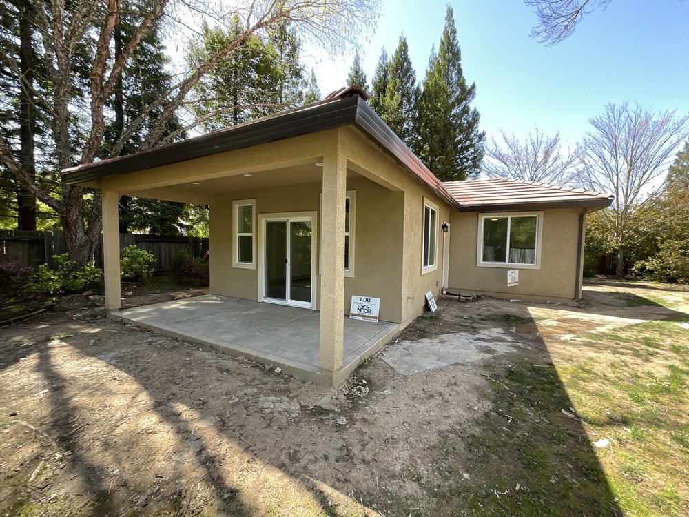 Modern farmhouse detached ADU exterior at dusk