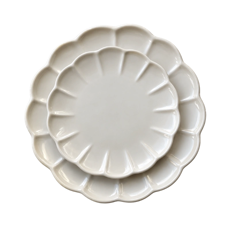Cream Scalloped side Plates on top of larger dinner plate