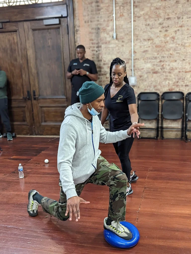 Physical therapist working with a patient at an event
