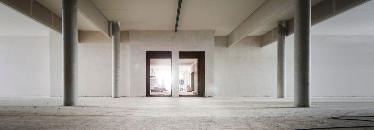 Stripped commercial unit with bare concrete floor, ready for the next fit-out