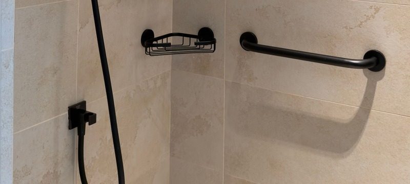 Matte black grab bar installed in a modern tiled shower