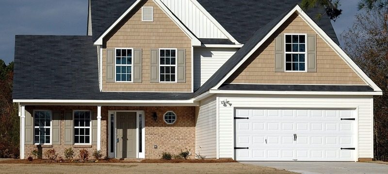 House exterior with new siding, windows, soffit and eavestrough